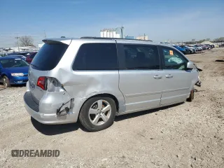2011 Volkswagen Routan SE with VIN 2V4RW3DG0BR621820, listed as a Copart auction lot 87670825 with 180,222 mi miles and Salvage title. Bid and sale history available at DreamBid. Image 3.