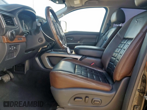 2017 Nissan Titan Platinum Reserve with VIN 1N6BA1F43HN568650, listed as a Copart auction lot 59593525 with 126,193 mi miles and Salvage title. Bid and sale history available at DreamBid. Image 7.