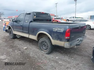2000 Ford F-150 XL with VIN 1FTRX18L1YNA08999, listed as a IAAI auction lot 41988747 with 214,201 mi miles. Bid and sale history available at carsss.com. Image 3.