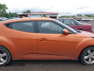 2012 Hyundai Veloster w/Gray Int with VIN KMHTC6AD3CU057620, listed as a IAAI auction lot 42320549 with 113,491 mi miles and . Bid and sale history available at DreamBid. Image 13.