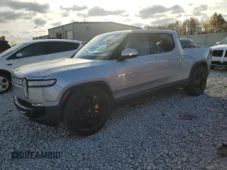 2023 Rivian R1T Adventure with VIN 7FCTGAAA2PN017170, listed as a Copart auction lot 77473014 with 28,821 mi miles and Salvage Title. Bid and sale history available at DreamBid. Image 1.