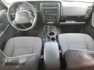 1999 Jeep Cherokee Sport with VIN 1J4FF68S2XL570795, listed as a Copart auction lot 61860585 with 320,467 mi miles and Salvage title. Bid and sale history available at DreamBid. Image 8.