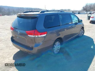 2013 Toyota Sienna XLE with VIN 5TDDK3DC6DS067612, listed as a IAAI auction lot 41756287 with 142,707 mi miles and . Bid and sale history available at DreamBid. Image 4.