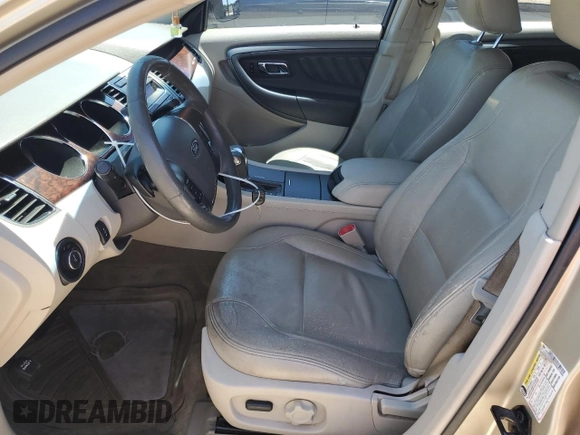 2011 Ford Taurus SEL z VIN 1FAHP2EW6BG176994, wystawiony jako Copart lot #56154735 z przebiegiem 211 017 mil mil oraz Szkoda całkowita • Salvage title. Historia ofert i sprzedaży dostępna na DreamBid. Obrazek 7.