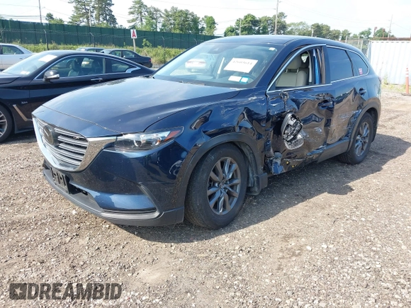 2021 Mazda CX-9 Touring with VIN JM3TCBCY7M0507699, listed as a IAAI auction lot 42603614 with 62,635 mi miles and . Bid and sale history available at DreamBid. Image 21.