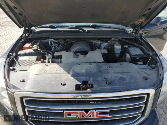 2015 GMC Yukon SLT with VIN 1GKS2BKC6FR145140, listed as a Copart auction lot 55451365 with 216,522 mi miles and Salvage Title. Bid and sale history available at DreamBid. Image 12.