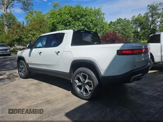 2023 Rivian R1T Adventure z VIN 7FCTGAAA1PN020478, wystawiony jako IAAI lot #42361936 z przebiegiem 443 mil mil oraz . Historia ofert i sprzedaży dostępna na DreamBid. Obrazek 3.