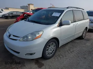 2009 Toyota Sienna XLE with VIN 5TDZK22C19S227678, listed as a IAAI auction lot 42074502 with 173,718 mi miles. Bid and sale history available at carsss.com. Image 2.