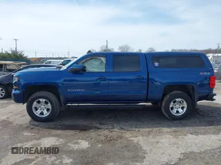 2017 Chevrolet Silverado 1500 LT with VIN 3GCUKREC5HG363503, listed as a IAAI auction lot 41833304 with 133,130 mi miles and . Bid and sale history available at DreamBid. Image 13.