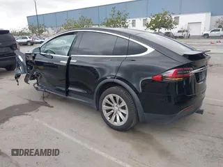 2017 Tesla Model X 90D with VIN 5YJXCAE2XHF075341, listed as a IAAI auction lot 41784008 with 77,439 mi miles and . Bid and sale history available at DreamBid. Image 3.