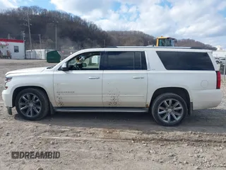 2015 Chevrolet Suburban LTZ with VIN 1GNSKKKC4FR304532, listed as a IAAI auction lot 41899860 with 123,624 mi miles. Bid and sale history available at carsss.com. Image 14.