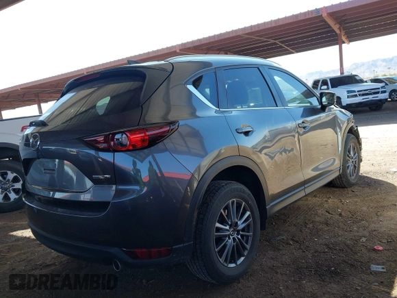 2021 Mazda CX-5 Touring with VIN JM3KFACM2M1313750, listed as a IAAI auction lot 41762938 with 68,503 mi miles. Bid and sale history available at carsss.com. Image 4.