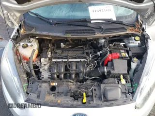 2019 Ford Fiesta SE z VIN 3FADP4EJ7KM147864, wystawiony jako IAAI lot #41692160 z przebiegiem 87 417 mil mil oraz . Historia ofert i sprzedaży dostępna na DreamBid. Obrazek 10.