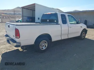 2002 Ford F-150 XL with VIN 1FTRX17W22KE34494, listed as a IAAI auction lot 41689313 with 250,243 mi miles. Bid and sale history available at carsss.com. Image 4.