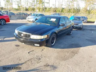 2002 Cadillac Seville Luxury SLS with VIN 1G6KS54Y82U305194, listed as a IAAI auction lot 40978923 with 115,813 mi miles. Bid and sale history available at carsss.com. Image 2.
