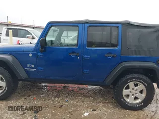 2009 Jeep Wrangler Unlimited X with VIN 1J4GA39189L787777, listed as a IAAI auction lot 41570579 with 193,163 mi miles. Bid and sale history available at carsss.com. Image 14.