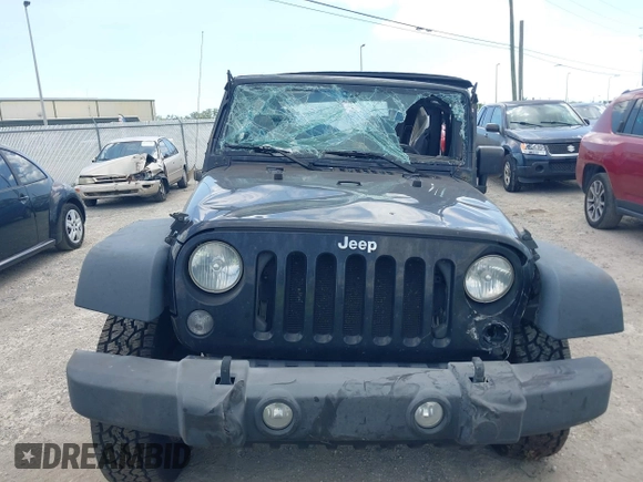 2015 Jeep Wrangler Freedom Edition with VIN 1C4AJWAG4FL681688, listed as a IAAI auction lot 42488018 with Not provided miles and . Bid and sale history available at DreamBid. Image 12.