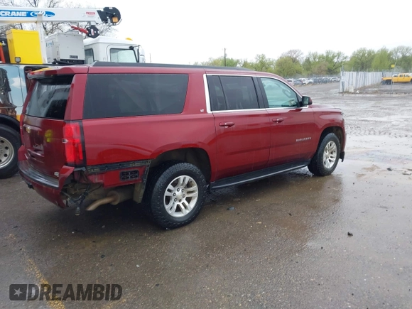 2020 Chevrolet Suburban LT with VIN 1GNSKHKC9LR233603, listed as a IAAI auction lot 41311582 with 104,754 mi miles. Bid and sale history available at carsss.com. Image 4.
