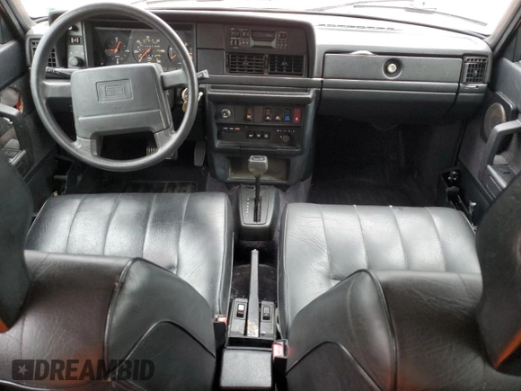 1993 Volvo 240 with VIN YV1AW8801P1942014, listed as a Copart auction lot 69491174 with 145,809 mi miles and Salvage title. Bid and sale history available at DreamBid. Image 8.