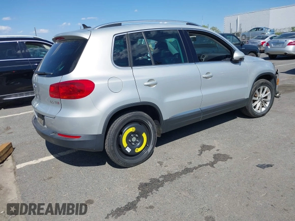2015 Volkswagen Tiguan SE with VIN WVGAV7AX0FW544218, listed as a IAAI auction lot 41897418 with 97,235 mi miles and . Bid and sale history available at DreamBid. Image 4.