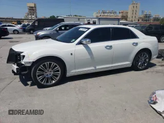 2013 Chrysler 300 Motown with VIN 2C3CCAAG9DH745597, listed as a Copart auction lot 52182265 with 129,869 mi miles and Salvage Title. Bid and sale history available at carsss.com. Image 1.