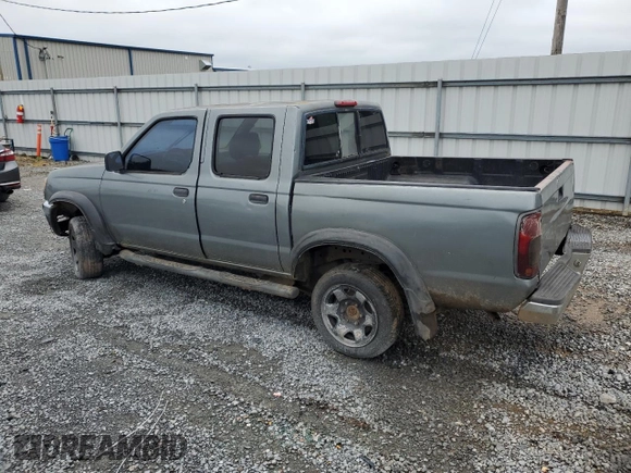 2000 Nissan Frontier XE with VIN 1N6ED27T2YC311037, listed as a Copart auction lot 57901285 with Not provided miles and Salvage title. Bid and sale history available at DreamBid. Image 2.