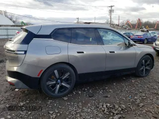 2023 BMW iX xDrive50 with VIN WB523CF03PCL64040, listed as a Copart auction lot 36400593 with 1,399 mi miles. Bid and sale history available at carsss.com. Image 3.