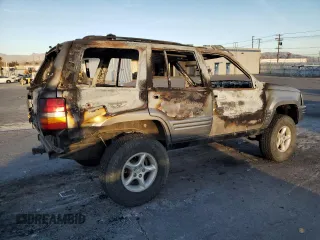 1998 Jeep Grand Cherokee Limited with VIN 1J4GZ88Z5WC119542, listed as a Copart auction lot 84562304 with 0 mi miles and Non Repairable. Bid and sale history available at carsss.com. Image 3.