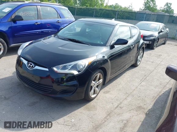 2013 Hyundai Veloster w/Gray Int with VIN KMHTC6ADXDU086856, listed as a IAAI auction lot 42503453 with 187,657 mi miles and . Bid and sale history available at DreamBid. Image 2.