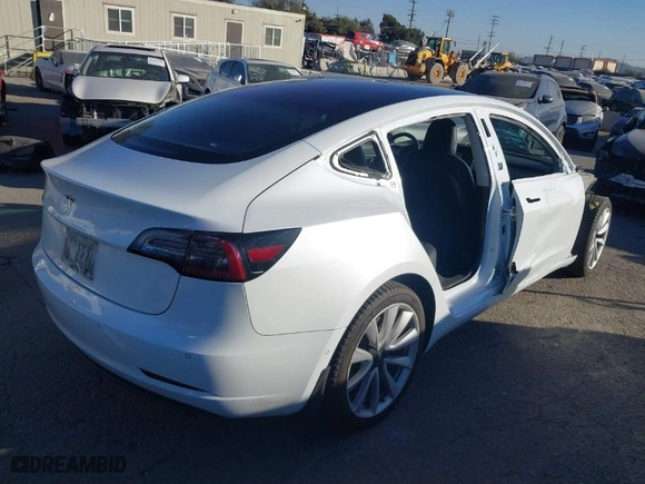2018 Tesla Model 3 Long Range Battery with VIN 5YJ3E1EA6JF042844, listed as a IAAI auction lot 41349172 with 122,851 mi miles. Bid and sale history available at carsss.com. Image 4.