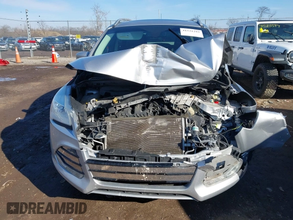 2015 Ford Escape Titanium with VIN 1FMCU0J93FUC02844, listed as a IAAI auction lot 41531293 with 115,392 mi miles and . Bid and sale history available at DreamBid. Image 13.