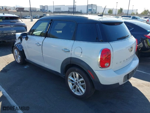 2014 MINI Cooper Countryman with VIN WMWZB3C53EWR39767, listed as a IAAI auction lot 41592112 with 129,403 mi miles. Bid and sale history available at carsss.com. Image 3.