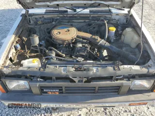 1986 Nissan Hardbody E z VIN 1N6ND16Y0GC394344, wystawiony jako Copart lot #86650524 z przebiegiem 122 949 mil mil oraz Tytuł czysty. Historia ofert i sprzedaży dostępna na DreamBid. Obrazek 11.