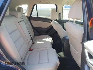 2016 Mazda CX-5 Touring z VIN JM3KE4CY8G0758947, wystawiony jako Copart lot #53140005 z przebiegiem 47 172 mil mil oraz Szkoda całkowita • Salvage title. Historia ofert i sprzedaży dostępna na DreamBid. Obrazek 11.