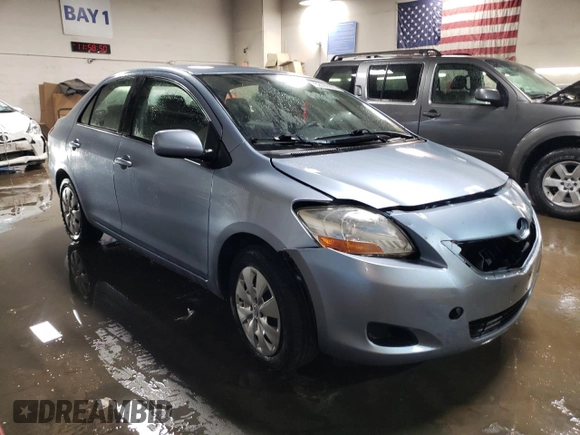 2010 Toyota Yaris with VIN JTDBT4K35A4064446, listed as a Copart auction lot 52099855 with 61,934 mi miles and Salvage Title. Bid and sale history available at carsss.com. Image 4.