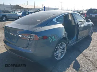 2014 Tesla Model S 60 with VIN 5YJSA1S11EFP35998, listed as a IAAI auction lot 42316563 with 83,835 mi miles and . Bid and sale history available at DreamBid. Image 4.