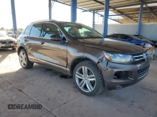 2012 Volkswagen Touareg Exec with VIN WVGEF9BP8CD008665, listed as a Copart auction lot 84611354 with 103,090 mi miles and Salvage Title. Bid and sale history available at DreamBid. Image 4.
