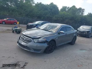 2013 Ford Taurus Limited with VIN 1FAHP2F87DG141383, listed as a IAAI auction lot 40200514 with 158,326 mi miles. Bid and sale history available at carsss.com. Image 2.