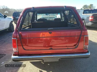 1990 Chevrolet Blazer z VIN 1GNCS18Z2L8113073, wystawiony jako Copart lot #87676865 z przebiegiem 22 827 mil mil oraz Szkoda całkowita • Salvage title. Historia ofert i sprzedaży dostępna na DreamBid. Obrazek 6.