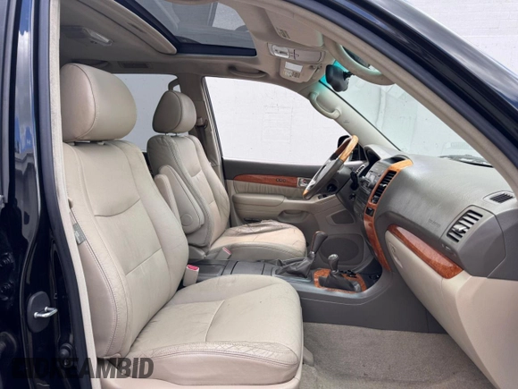 2005 Lexus GX 470 with VIN JTJBT20X050079831, listed as a Copart auction lot 56405105 with 390,415 mi miles and Clean Title. Bid and sale history available at DreamBid. Image 5.