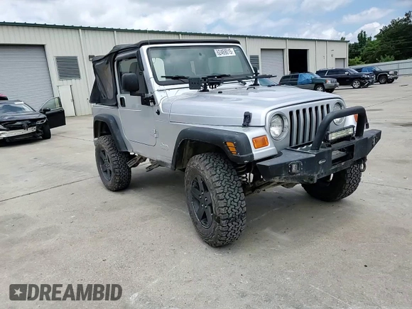 2005 Jeep Wrangler X with VIN 1J4FA39S55P353789, listed as a Copart auction lot 62469015 with 143,817 mi miles and Salvage title. Bid and sale history available at DreamBid. Image 13.