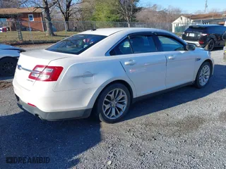 2013 Ford Taurus Limited with VIN 1FAHP2F82DG131585, listed as a IAAI auction lot 41076163 with 134,916 mi miles. Bid and sale history available at carsss.com. Image 4.