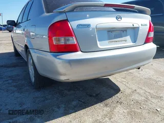 2000 Mazda Protege ES with VIN JM1BJ2213Y0284890, listed as a IAAI auction lot 42088671 with 215,104 mi miles and . Bid and sale history available at DreamBid. Image 6.