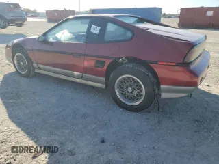 1987 Pontiac Fiero GT z VIN 1G2PG1195HP233666, wystawiony jako Copart lot #78981714 z przebiegiem Nie podano mil oraz Szkody całkowita. Historia ofert i sprzedaży dostępna na DreamBid. Obrazek 2.