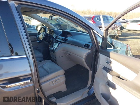2014 Honda Odyssey Touring with VIN 5FNRL5H94EB081267, listed as a IAAI auction lot 41199509 with 146,827 mi miles and . Bid and sale history available at DreamBid. Image 5.