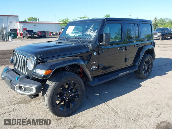 2023 Jeep Wrangler Sahara z VIN 1C4JJXP60PW627051, wystawiony jako IAAI lot #42290712 z przebiegiem 28 269 mil mil oraz . Historia ofert i sprzedaży dostępna na DreamBid. Obrazek 2.