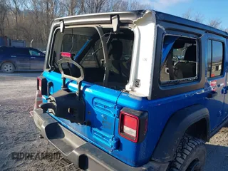 2021 Jeep Wrangler Unlimited Sport S with VIN 1C4HJXDN4MW779291, listed as a IAAI auction lot 41290109 with 43,379 mi miles and . Bid and sale history available at DreamBid. Image 6.
