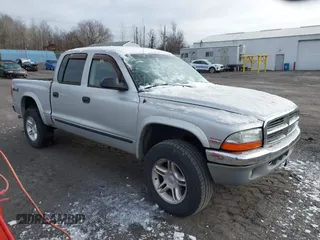 2004 Dodge Dakota SLT with VIN 1D7HG48N04S603763, listed as a IAAI auction lot 41607984 with 157,360 mi miles. Bid and sale history available at carsss.com. Image 1.