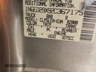 2002 Nissan Frontier XE z VIN 1N6ED29X92C367175, wystawiony jako Copart lot #54979685 z przebiegiem 281 470 mil mil oraz Szkoda całkowita • Salvage title. Historia ofert i sprzedaży dostępna na DreamBid. Obrazek 13.