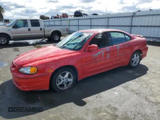 1999 Pontiac Grand Am GT1 with VIN 1G2NW52E5XM768638, listed as a Copart auction lot 49077115 with 113,018 mi miles and Salvage Title. Bid and sale history available at carsss.com. Image 1.